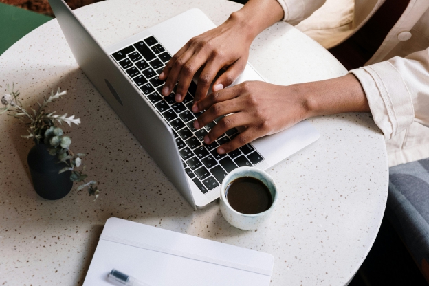 Blogging Blogger typing on a laptop