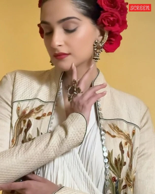 Her hair was styled in a sleek bun, adorned with roses. (Photo: Sonam Kapoor/Instagram)