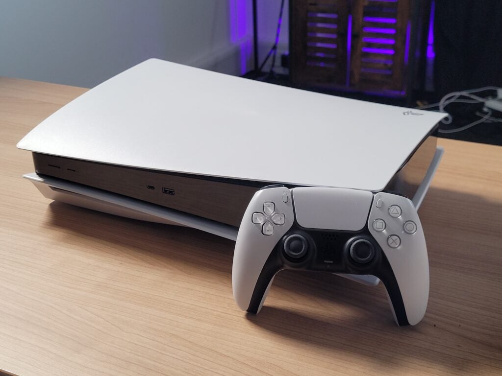 PS5 console with controller on the side